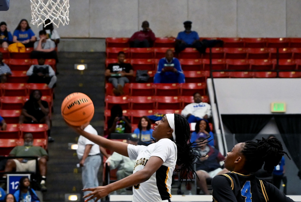 Plantation American Heritage guard Tyra Blye drives to the basket during the Class 5A state championship against Daytona Mainland on Friday at the RP Funding Center in Lakeland.